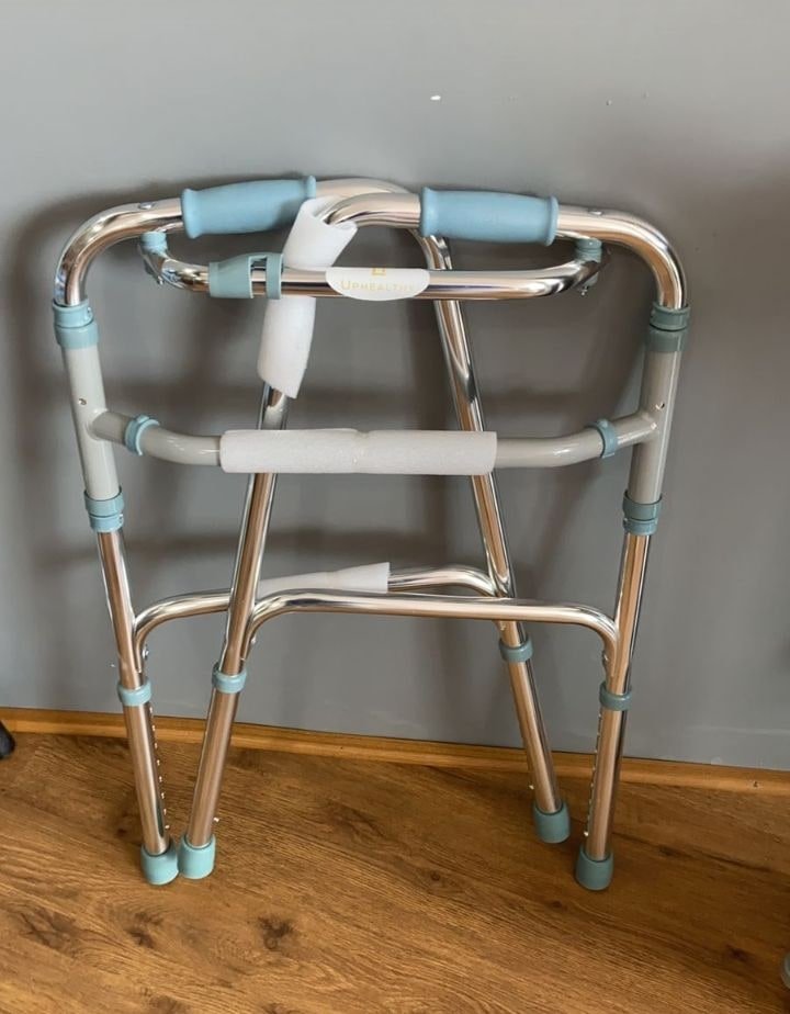 Aluminium folding walker, folded flat